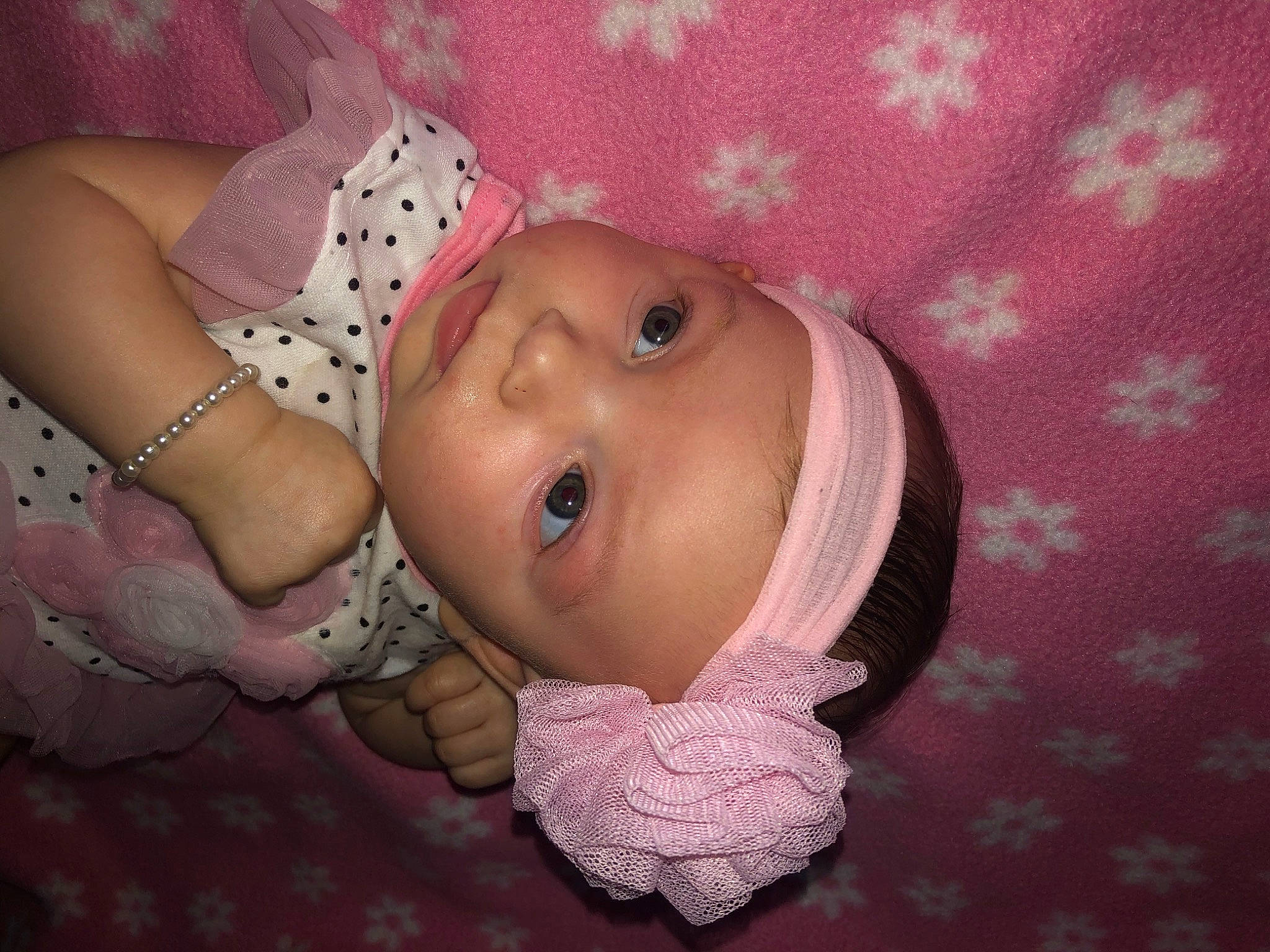 Jaazaniah is registered to the contest to win money with this photo: baby, baby_toddler_clothing, cheek, chin, eye, eyebrow, face, finger, head, headgear, headwear, human_body, iris, lip, mouth, nose, person, pink, skin, smile