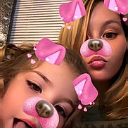 Aylani is registered to the contest to win money with this photo: child, woman, face_filter, pink_ears, dog_nose, tongue_out, indoor, window_blinds, casual_clothing, playful, closeup, portrait, happy, fun, family, selfie, blonde_hair, brown_hair, expression, digital_filter