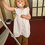 Cassie-Mai joined the competition — help win amazing prizes! toddler, child, pacifier, dress, boots, indoor, carpet, cat, calico_cat, door, glass_door, furniture, chair, person, cute, standing, home, young_child, carpeted_floor, long_hair