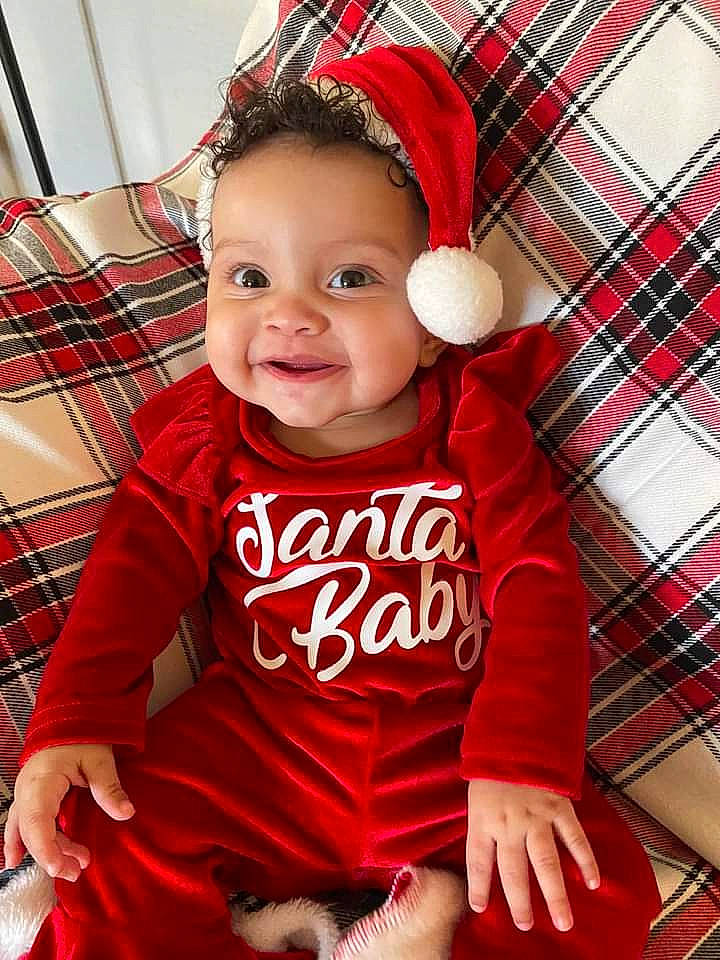 Amara joined the competition — help win amazing prizes! baby, baby_toddler_clothing, child, fun, happy, human, magenta, mammal, pattern, person, pink, plaid, product, red, skin, sleeve, smile, standing, tartan, toddler