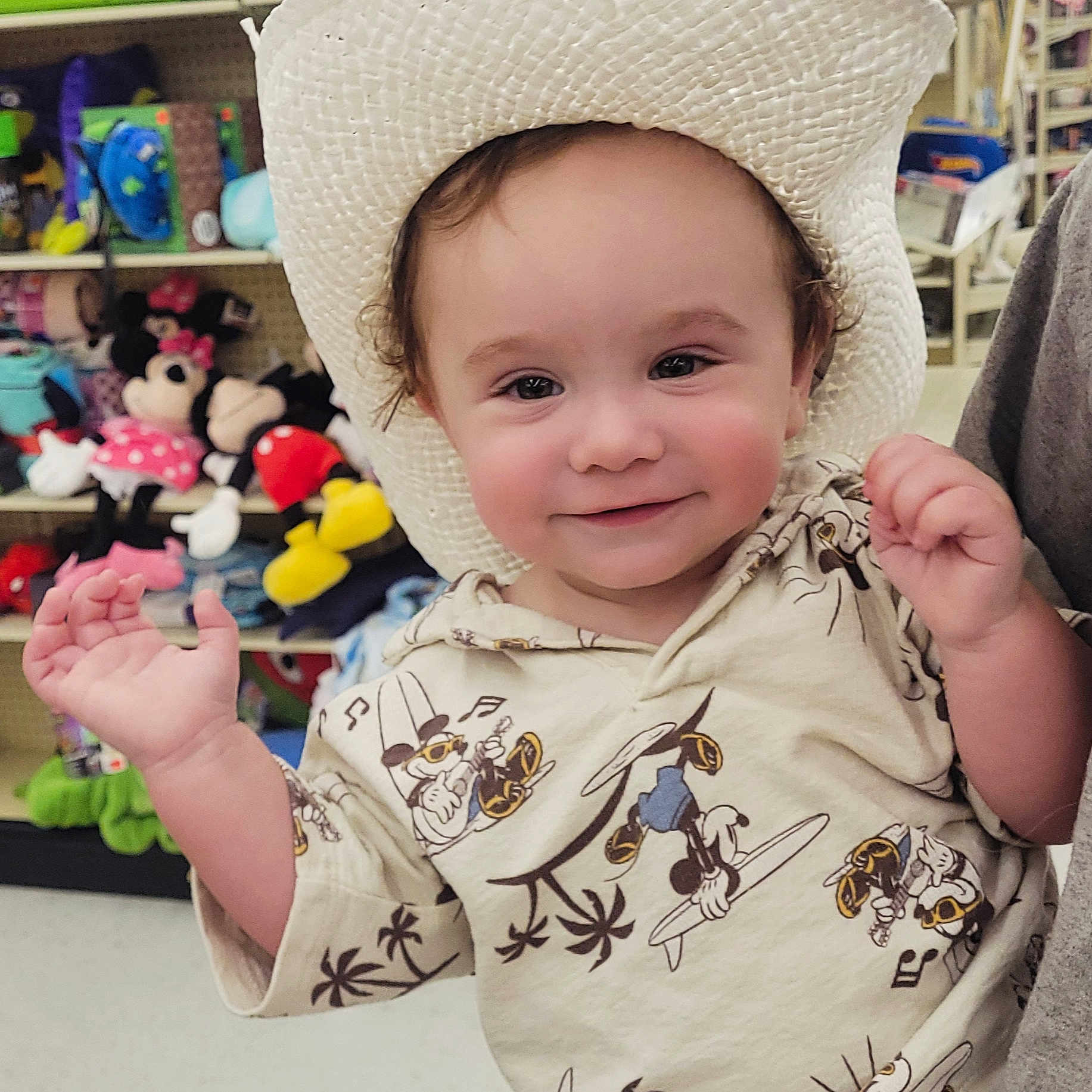Danny is registered to the contest to win money with this photo: baby, bodypart, bonnet, cap, clothing, costume, face, finger, hand, happy, hat, head, indoors, person, photography, portrait, smile, sunhat, t_shirt, toy