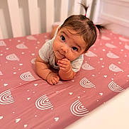 Angelica joined the competition — help win amazing prizes! baby, bedroom, child, crib, curious, eyes, face, fingers, hair, hand, indoors, infant, lying_down, mattress, nursery, pigtails, pink, portrait, rainbow_pattern, sitting