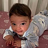 Angelica joined the competition — help win amazing prizes! baby, infant, child, smiling, portrait, crib, bed, bedding, indoors, nursery, lying_down, tummy_time, hands, brown_hair, eyes, pajamas, floral_pattern, pink_blanket, white_crib, happy