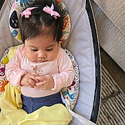 Ruth joined the competition — help win amazing prizes! baby, infant, child, pink_bows, baby_seat, blanket, clothing, hands, hair, cute, indoors, carpet, couch, fabric, comfort, seat, portrait, toddler, looking_down, cozy