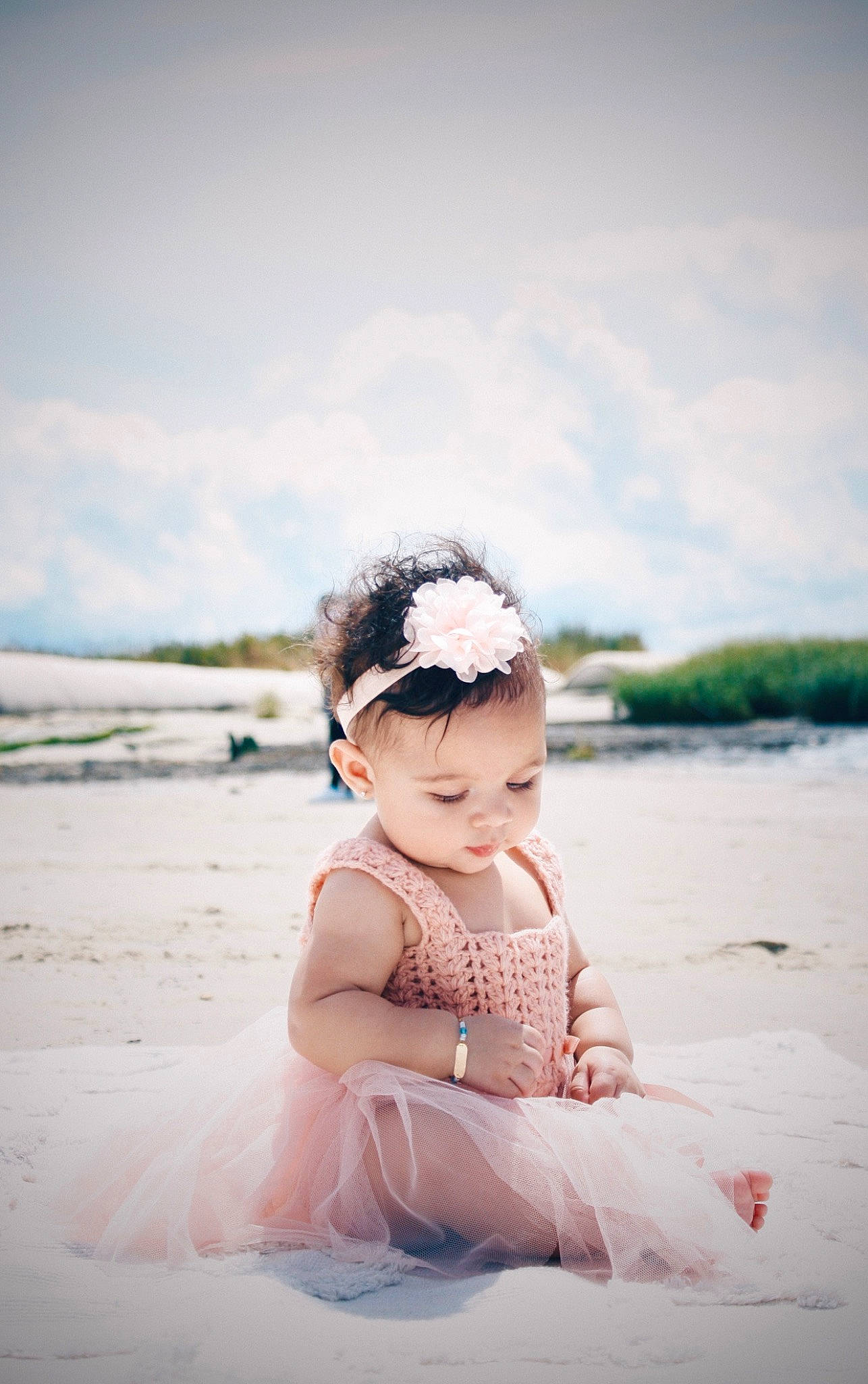 Alani is registered to the contest to win money with this photo: baby, baby_toddler_clothing, beach, child, cloud, dress, fashion_accessory, flash_photography, fun, grass, hair_accessory, happy, horizon, ocean, people_in_nature, person, portrait_photography, sand, sitting, sky