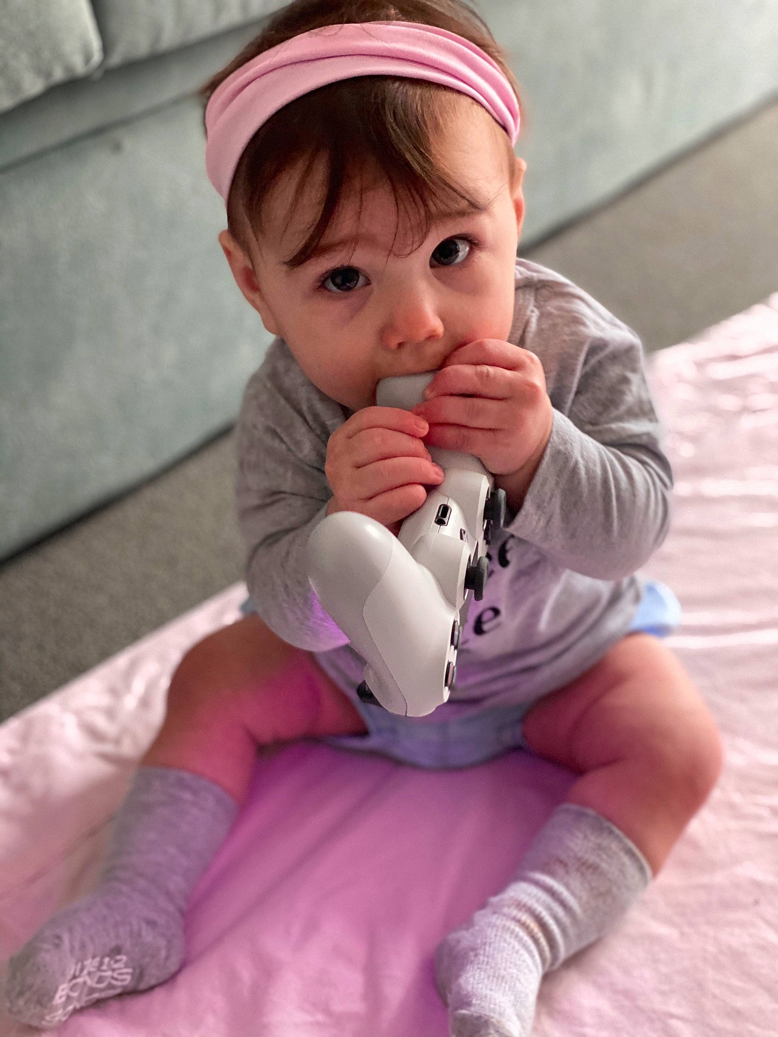 Maia is registered to the contest to win money with this photo: baby, child, finger, hand, headgear, leg, person, pink, play, product, skin, thumb, toddler