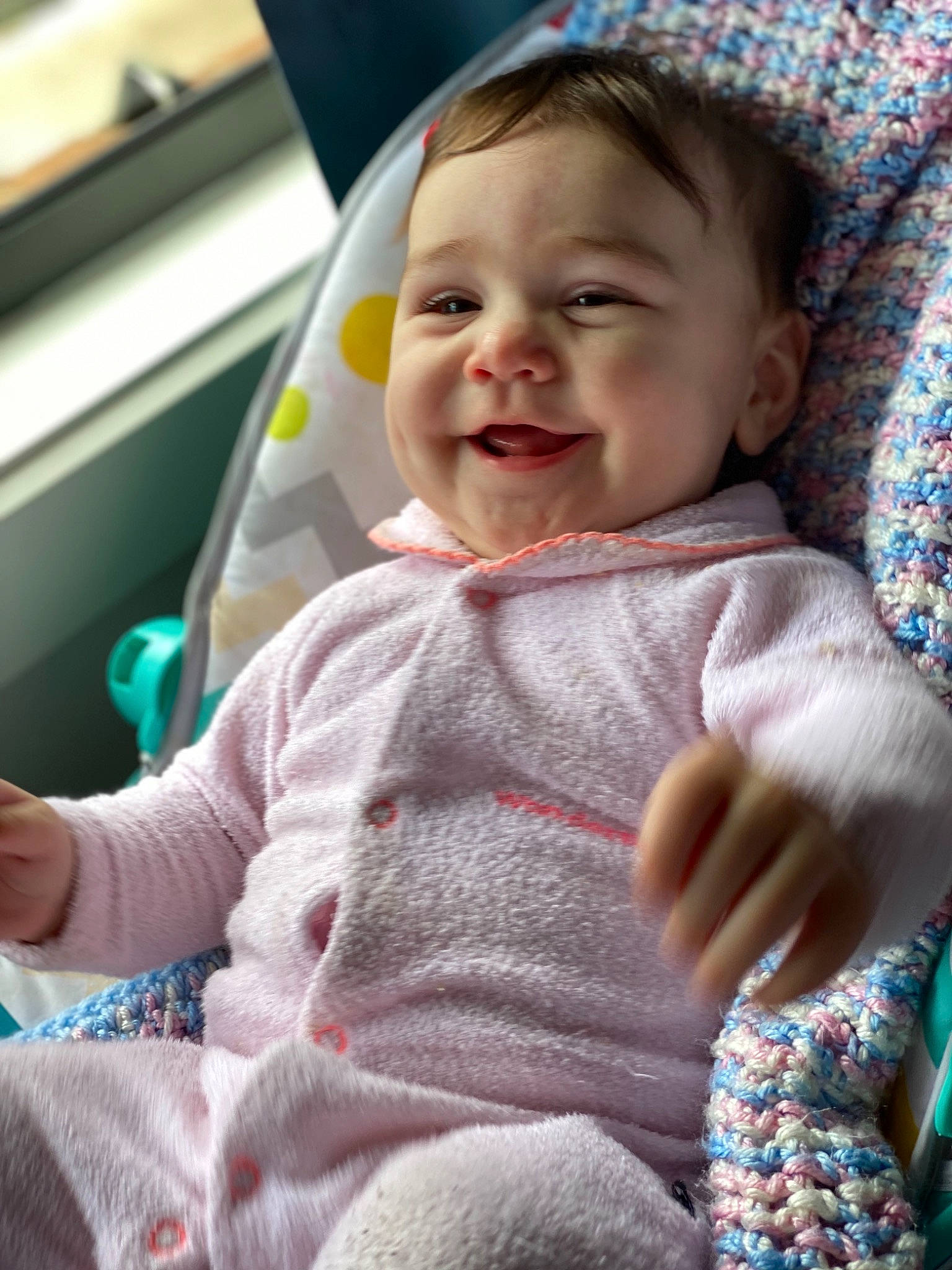 Maia is registered to the contest to win money with this photo: baby, baby_in_car_seat, birth, cheek, child, face, facial_expression, joy, person, skin, smile, textile, toddler