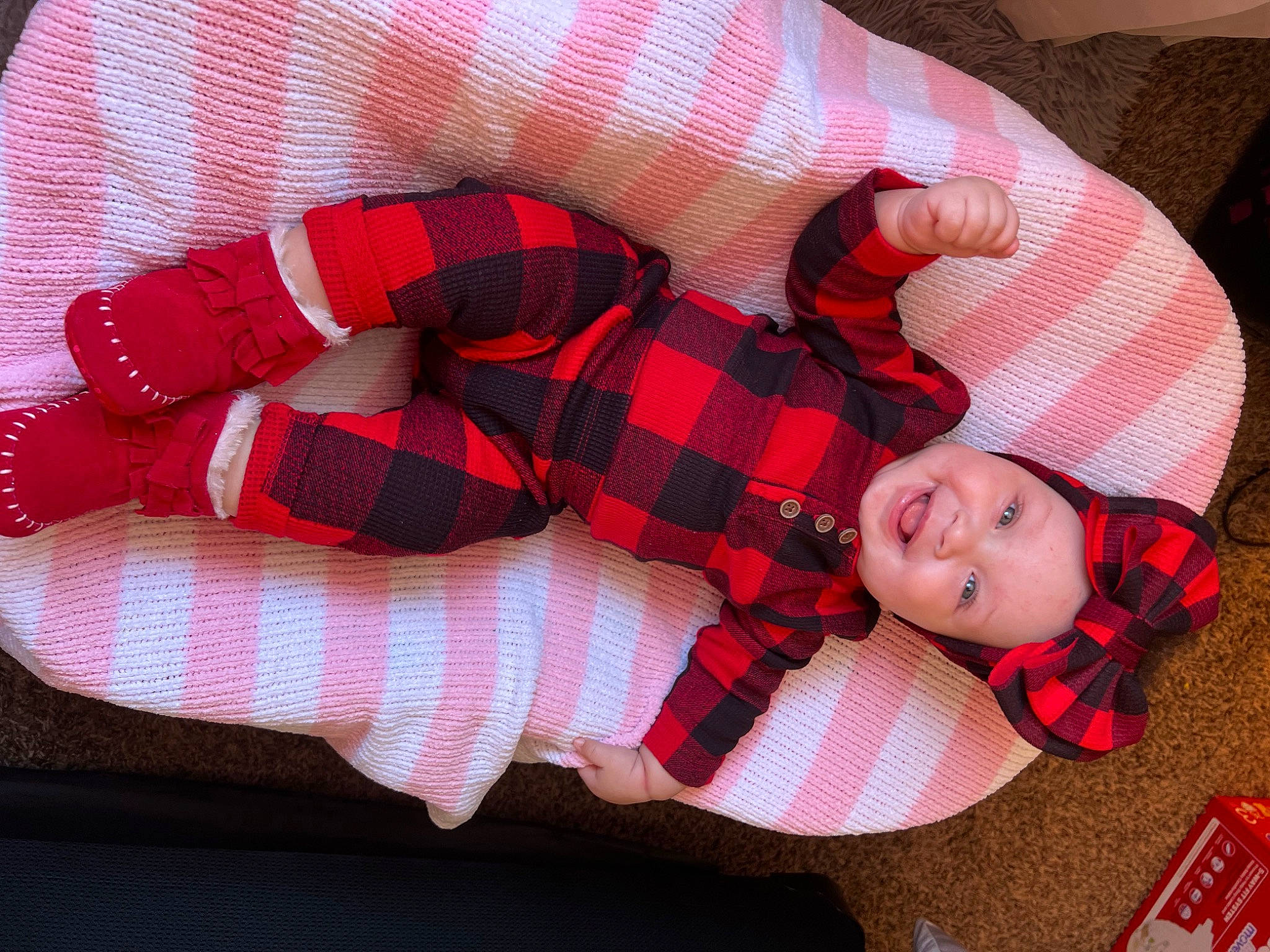 Amoura joined the competition — help win amazing prizes! baby, baby_toddler_clothing, child, comfort, finger, hand, headwear, human_leg, joy, knee, lap, linens, pattern, person, plaid, product, sleeve, smile, sock, tartan