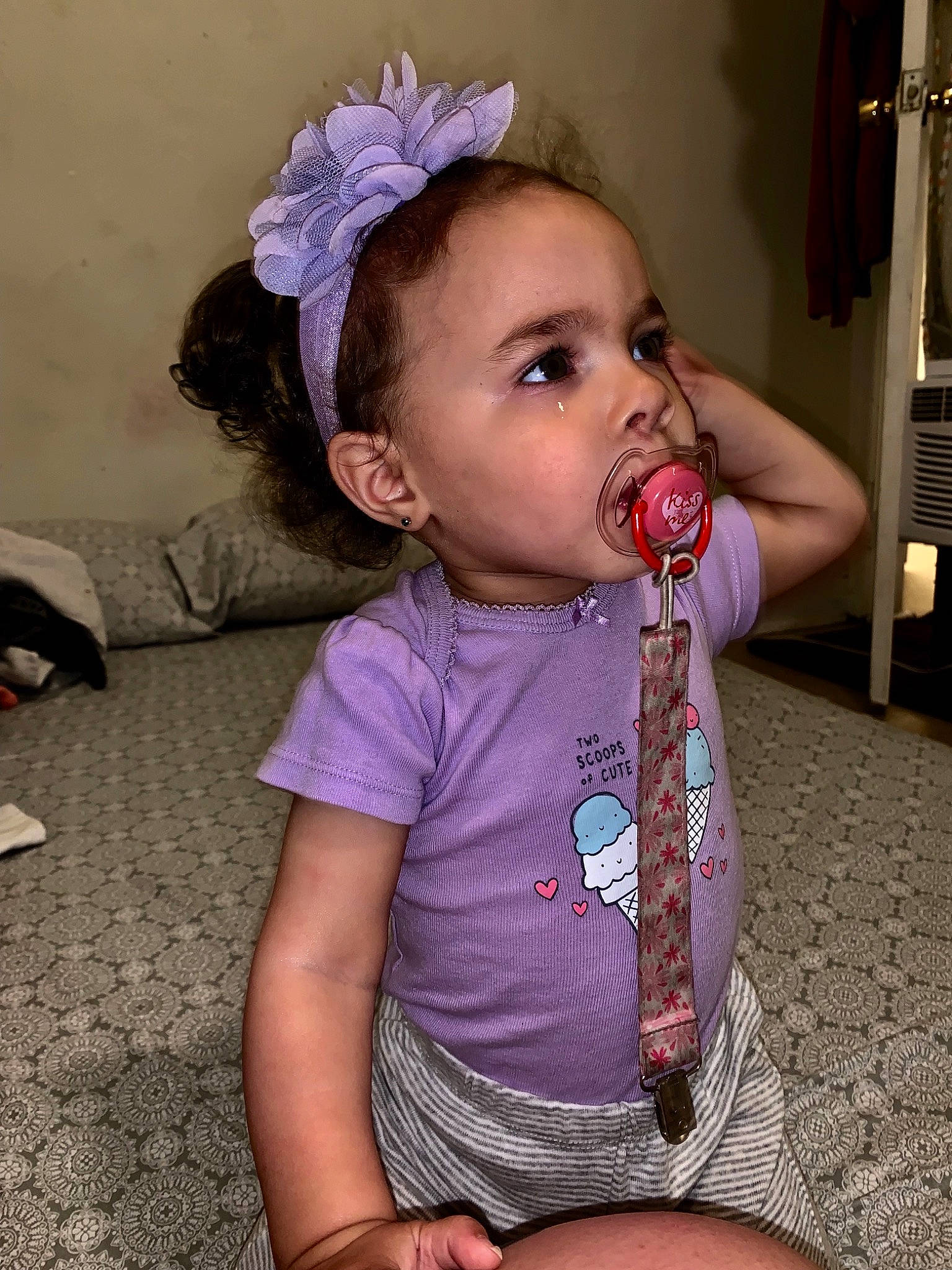 Aaliyah is registered to the contest to win money with this photo: baby, baby_toddler_clothing, cheek, child, fashion_accessory, fun, hair_accessory, headband, headgear, headpiece, mouth, person, pink, sitting, toddler