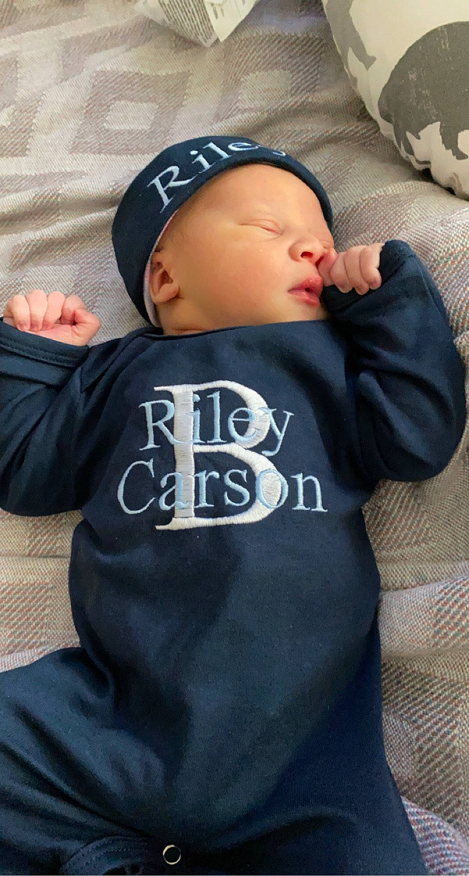 Riley joined the competition — help win amazing prizes! arm, baby, baby_products, baby_sleeping, baby_toddler_clothing, baseball_cap, cap, child, comfort, elbow, electric_blue, grey, hat, headwear, linens, outerwear, pattern, person, sleeve, t_shirt