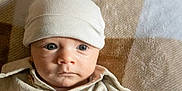 Aizen is registered to the contest to win money with this photo: baby, infant, hat, clothing, face, eyes, blanket, portrait, cute, newborn, child, soft, warm, indoors, closeup, headwear, expression, young, person, skin