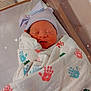 newborn, baby, hospital, bassinet, blanket, handprints, hat, striped, sleeping, wrapped, infant, cute, bow, skin, peaceful, indoors, soft_light, sparkles, portrait, child