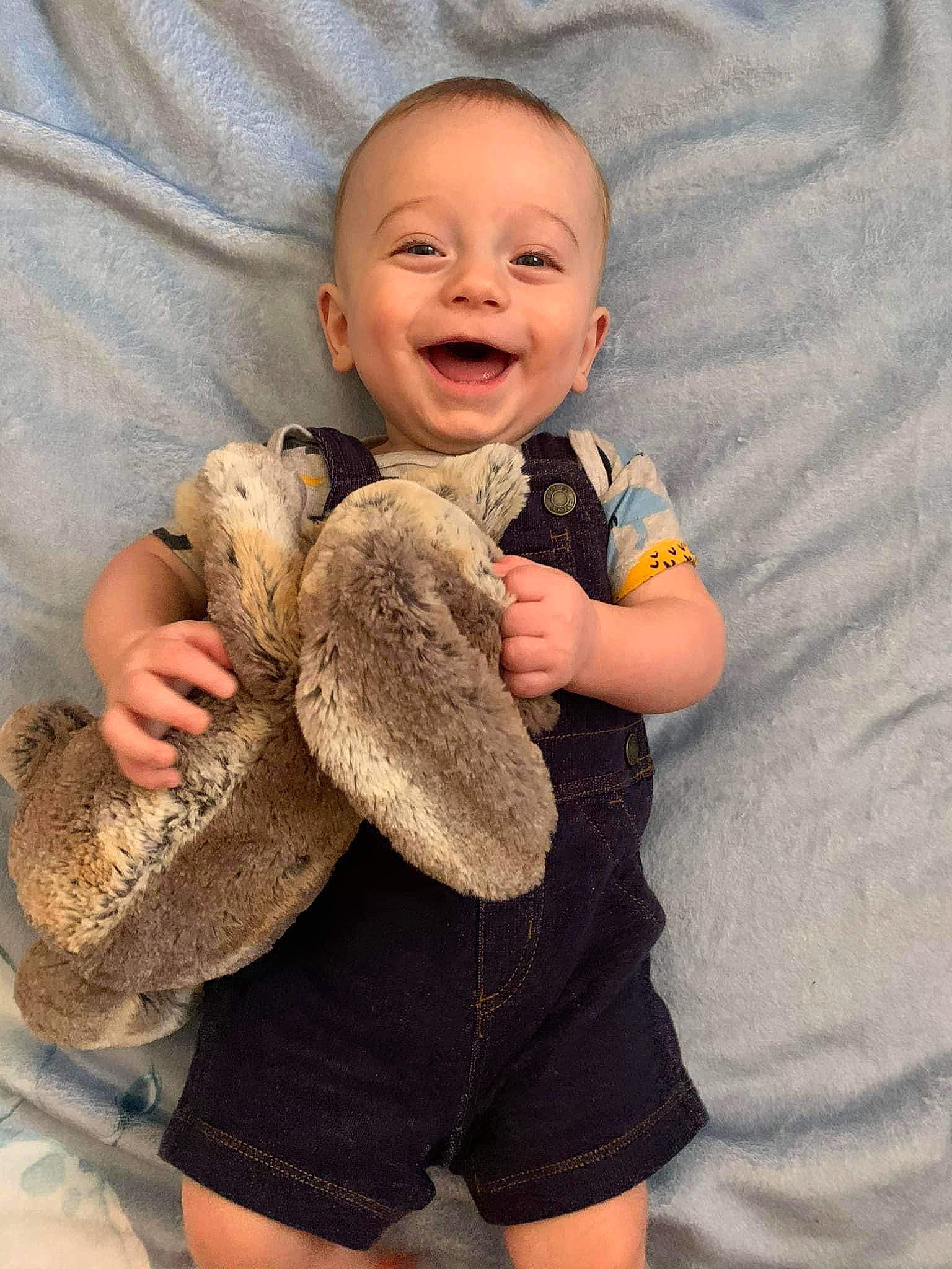 Frankie is registered to the contest to win money with this photo: baby_toddler_clothing, cheek, comfort, eye, finger, gesture, hand, happy, head, leg, mammal, nose, person, skin, sleeve, smile, t_shirt, textile, thumb, toddler