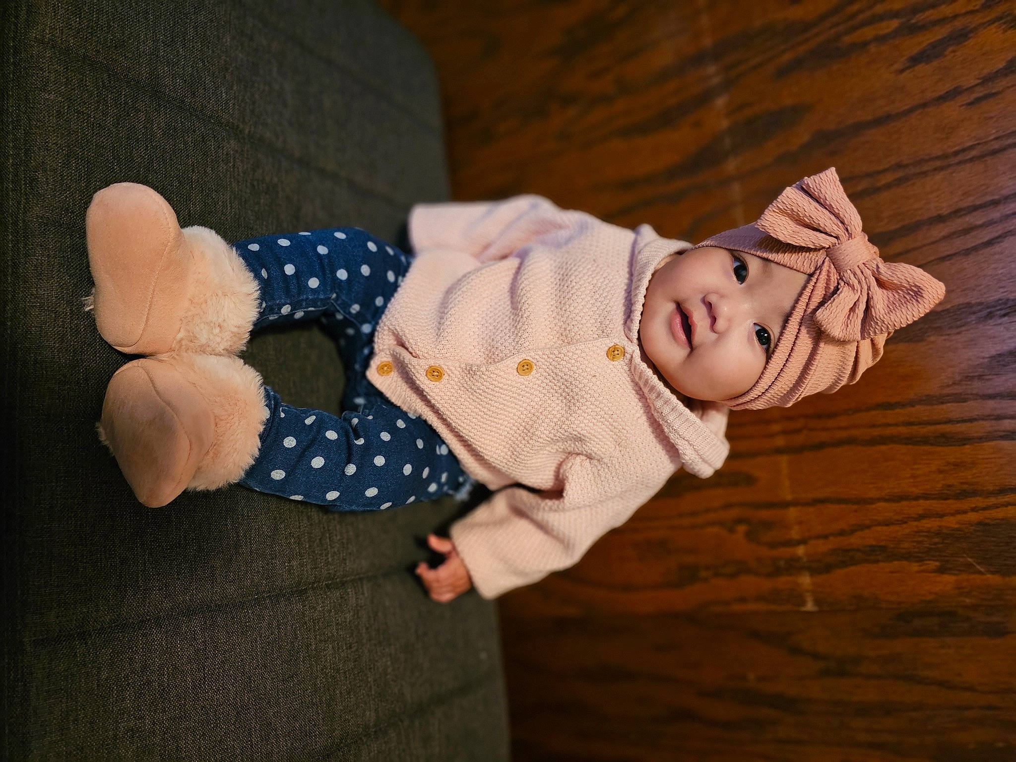 Rosie is registered to the contest to win money with this photo: baby, baby_products, baby_sleeping, baby_toddler_clothing, child, comfort, fashion_accessory, gesture, hardwood, hat, headgear, headwear, linens, pattern, person, product, room, sitting, sleeve, textile