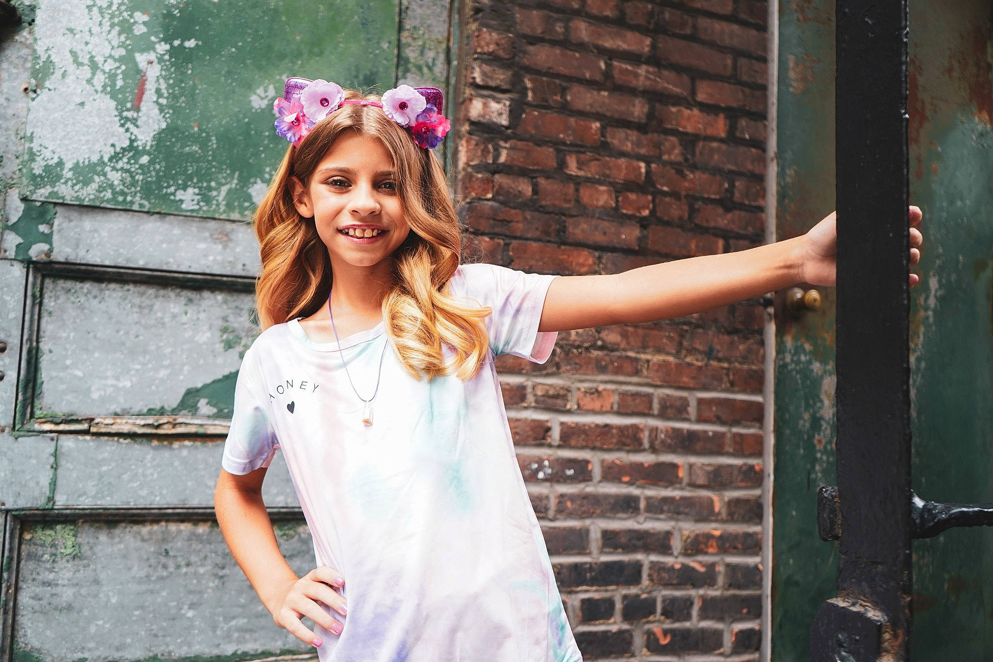 Gabrielle is registered to the contest to win money with this photo: cool, eyewear, fashion_design, flash_photography, happy, headgear, human_body, joy, leisure, lip, person, pink, plant, shoulder, sleeve, smile, standing, street_fashion, t_shirt, temple