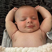 Barrett joined the competition — help win amazing prizes! baby, sleeping, smile, arms_up, blanket, soft_texture, peaceful, infant, closeup, skin, relaxed, comfort, resting, cute, portrait, child, indoors, young, face, happy