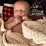 Barrett is registered to the contest to win money with this photo: baby, blanket, sleeping, infant, cozy, soft_texture, plaid, pattern, resting, peaceful, wrapped, fingers, closed_eyes, indoor, cute, newborn, portrait, comfort, warm, child