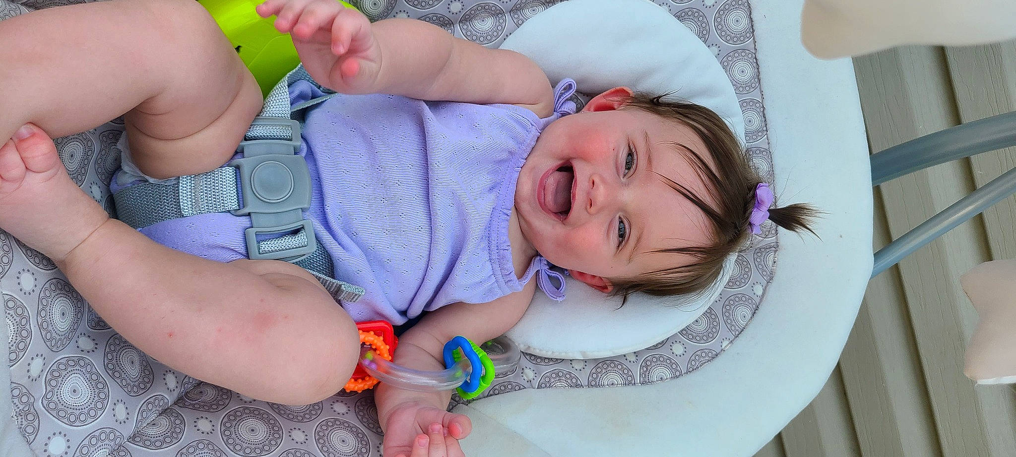 Rylee is registered to the contest to win money with this photo: arm, baby, baby_toddler_clothing, cheek, child, comfort, facial_expression, finger, fun, gesture, green, happy, iris, mouth, person, pink, skin, smile, summer, textile