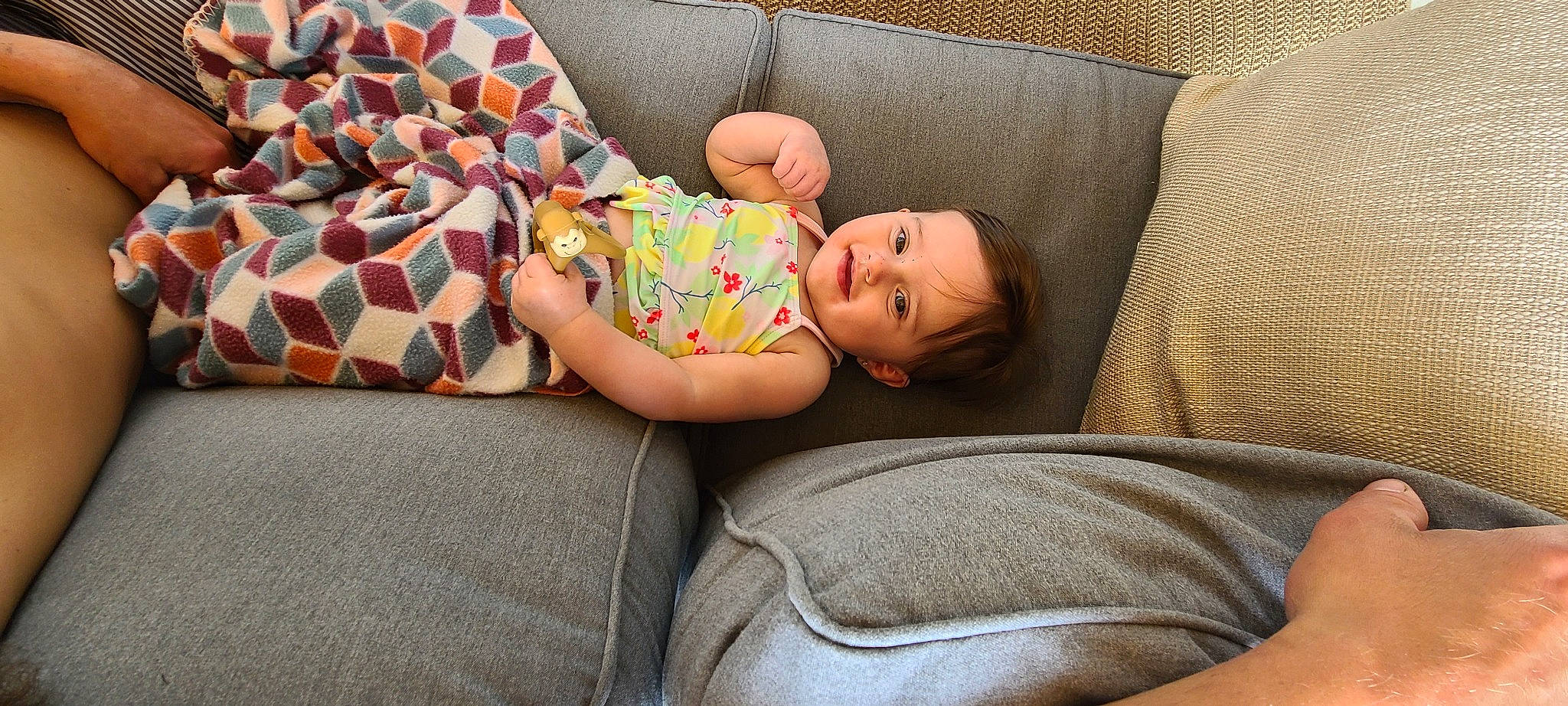 Rylee joined the competition — help win amazing prizes! baby, baby_products, baby_toddler_clothing, bedtime, child, comfort, couch, human_leg, lap, linens, living_room, nap, pattern, person, room, sitting, textile, thigh, throw_pillow, toddler