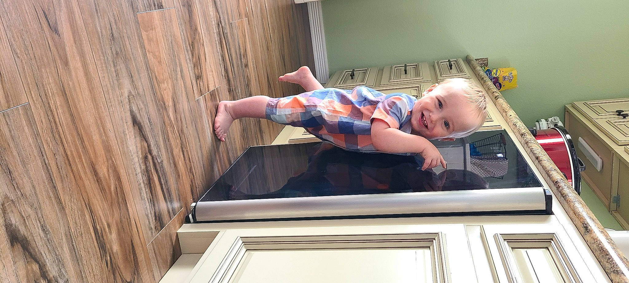 Ridge is registered to the contest to win money with this photo: arm, baby, baby_laughing, baby_toddler_clothing, child, face, finger, fun, hair, hand, happy, human_body, joy, leg, leisure, person, smile, standing, t_shirt, toddler