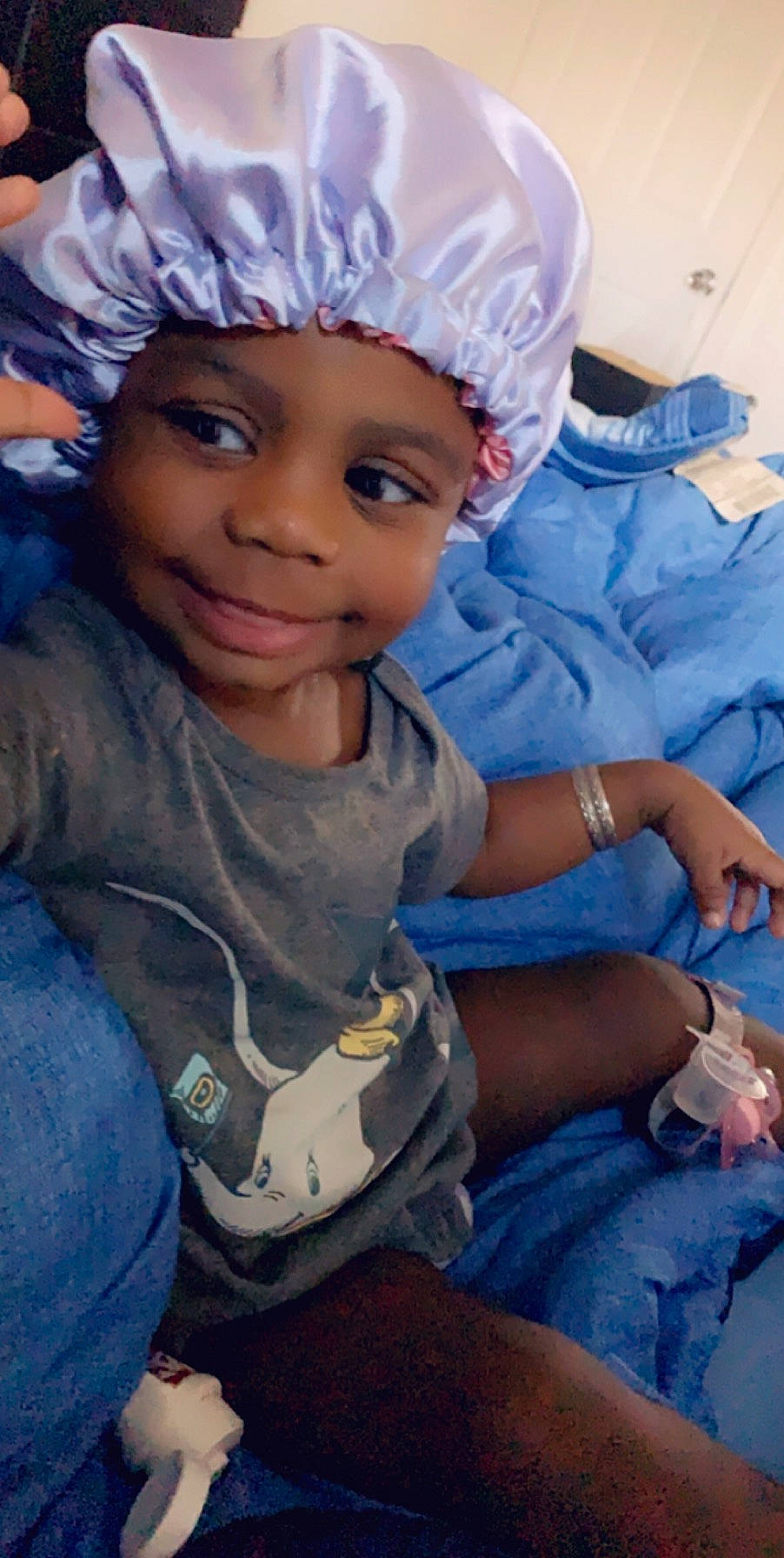 Egypt is registered to the contest to win money with this photo: child, headgear, headwear, person, smile, toddler