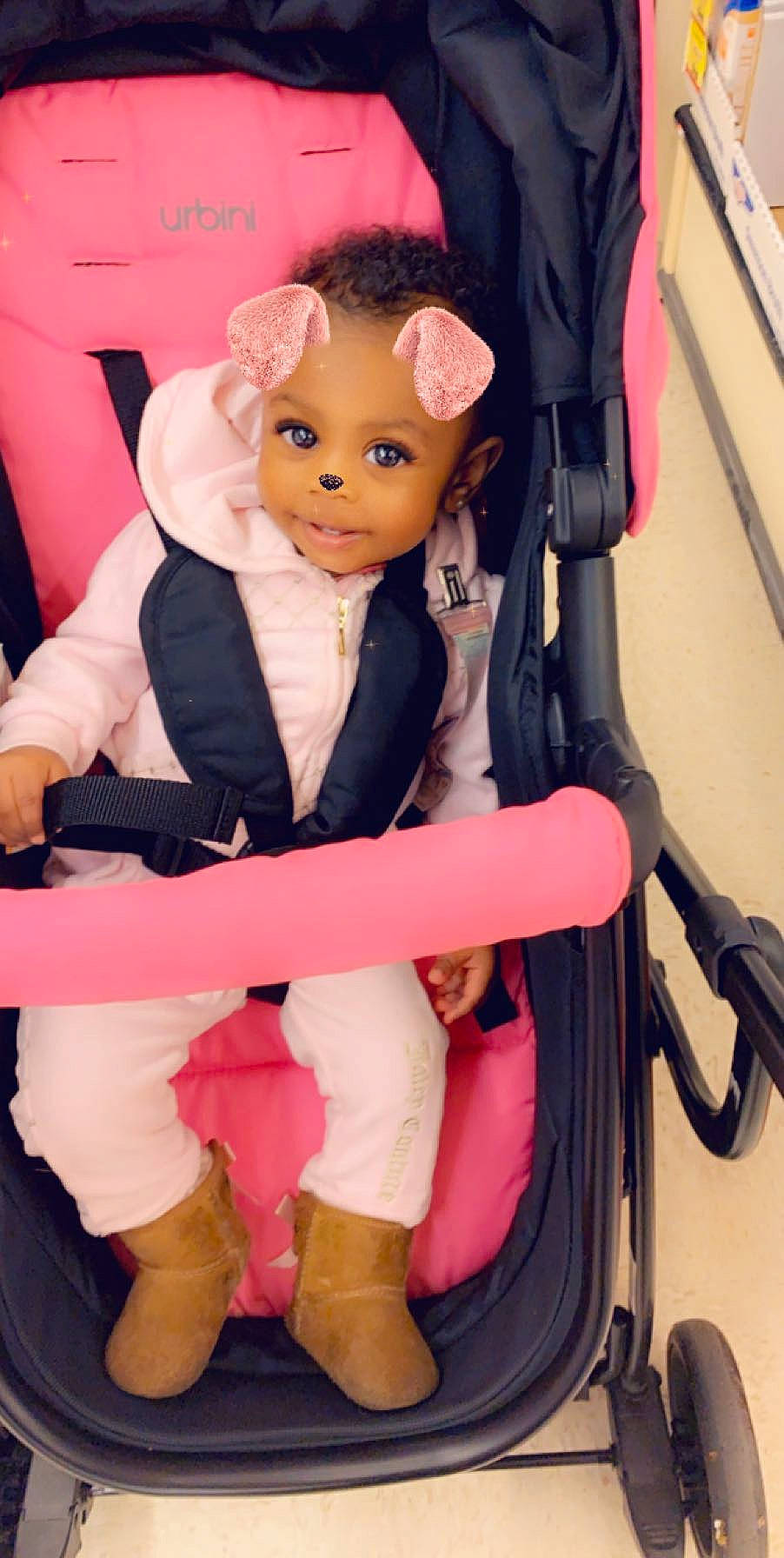 Egypt is registered to the contest to win money with this photo: baby_carriage, baby_products, car_seat, child, doll, person, pink, product, sitting, toddler, toy