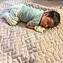 Izarayla is registered to the contest to win money with this photo: baby, sleeping, blanket, quilt, infant, clothing, glove, indoor, peaceful, child, face, head, rest, soft, cute, newborn, person, toddler, cozy, quiet