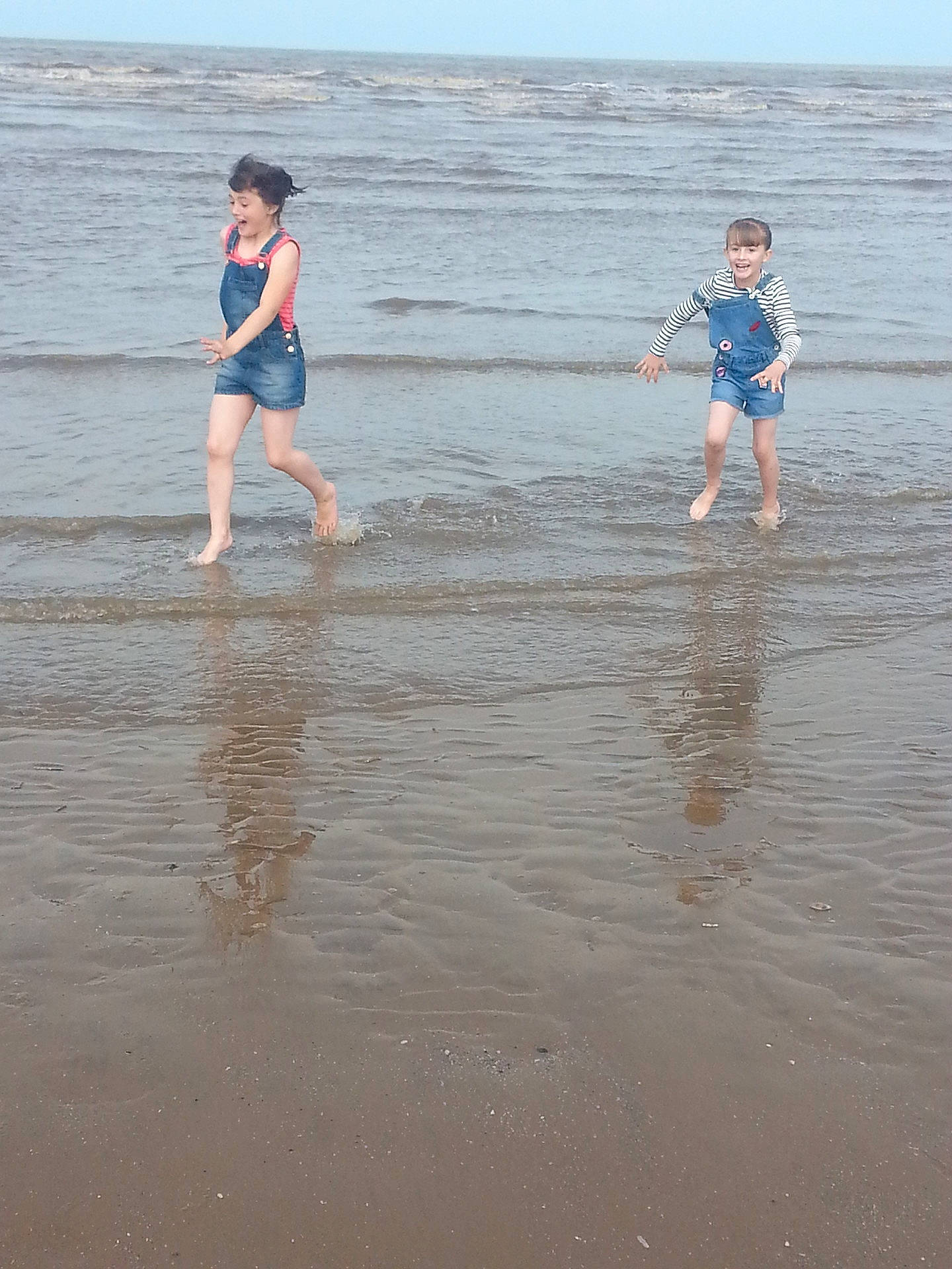 Ellie-mai is registered to the contest to win money with this photo: beach, body_of_water, coast, coastal_and_oceanic_landforms, fun, girl, joy, mudflat, ocean, person, play, recreation, sand, sea, shore, sky, summer, tide, vacation, water