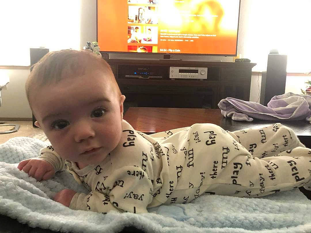 Bodhi is registered to the contest to win money with this photo: baby, bed, bedtime, cheek, child, couch, electronic_device, furniture, gadget, head, home, house, living_room, person, play, room, selfie, sitting, skin, technology