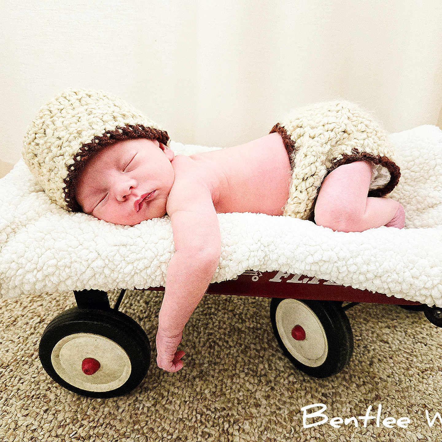 Bentlee joined the competition — help win amazing prizes! baby, blanket, bonnet, cap, clothing, crib, face, furniture, hat, head, hosiery, infantbed, machine, newborn, person, photography, portrait, sleeping, sock, wheel