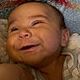Silas is registered to the contest to win money with this photo: baby, smiling, face, infant, blanket, cozy, happy, child, portrait, cute, expression, skin, eyes, clothing, lying_down, cheeks, soft, head, young, person