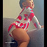 Zoe Zawadi joined the competition — help win amazing prizes! toddler, child, couch, clothing, watermelon_pattern, indoor, curious, climbing, baby, portrait, person, furniture, cute, side_view, long_sleeve, young_child, home, light, skin, face
