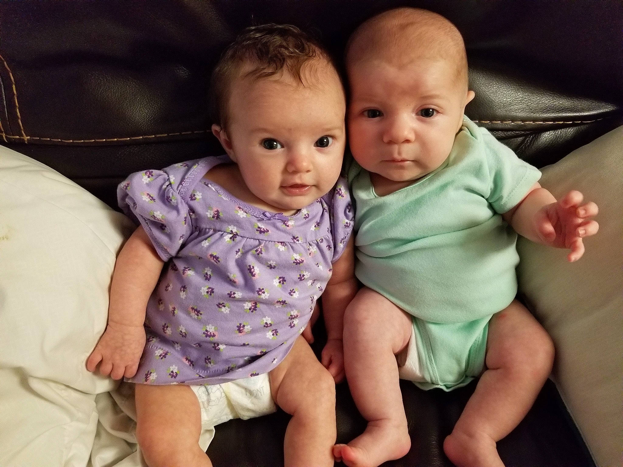 Jubilee is registered to the contest to win money with this photo: arm, baby, cheek, child, eye, face, family, hand, head, human, interaction, iris, leg, people, person, product, sibling, sitting, skin, smile