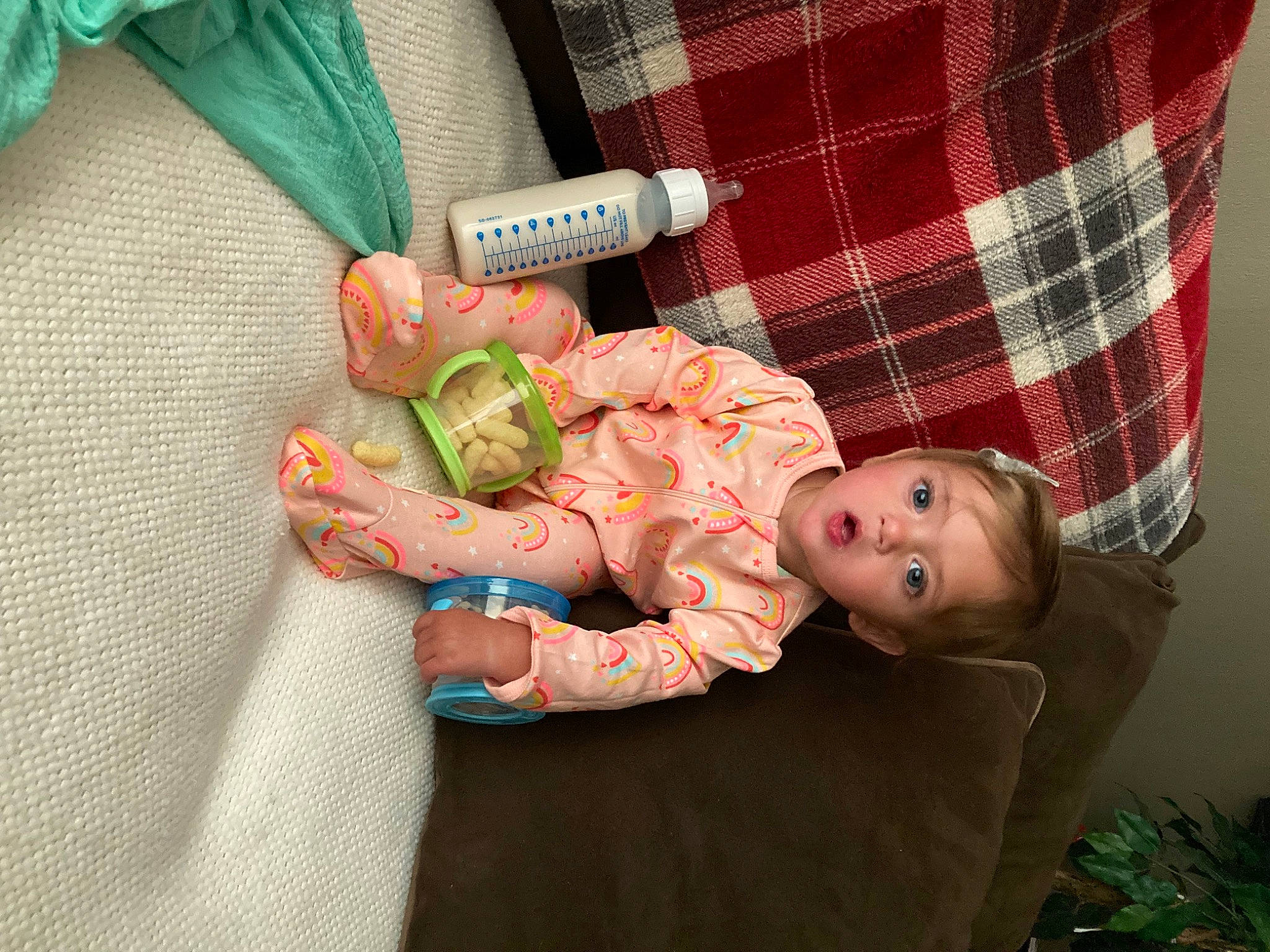 Aryah joined the competition — help win amazing prizes! baby, baby_products, baby_toddler_clothing, child, comfort, finger, flash_photography, grass, hand, lap, nail, pattern, person, plaid, room, sitting, skin, tartan, textile, toddler