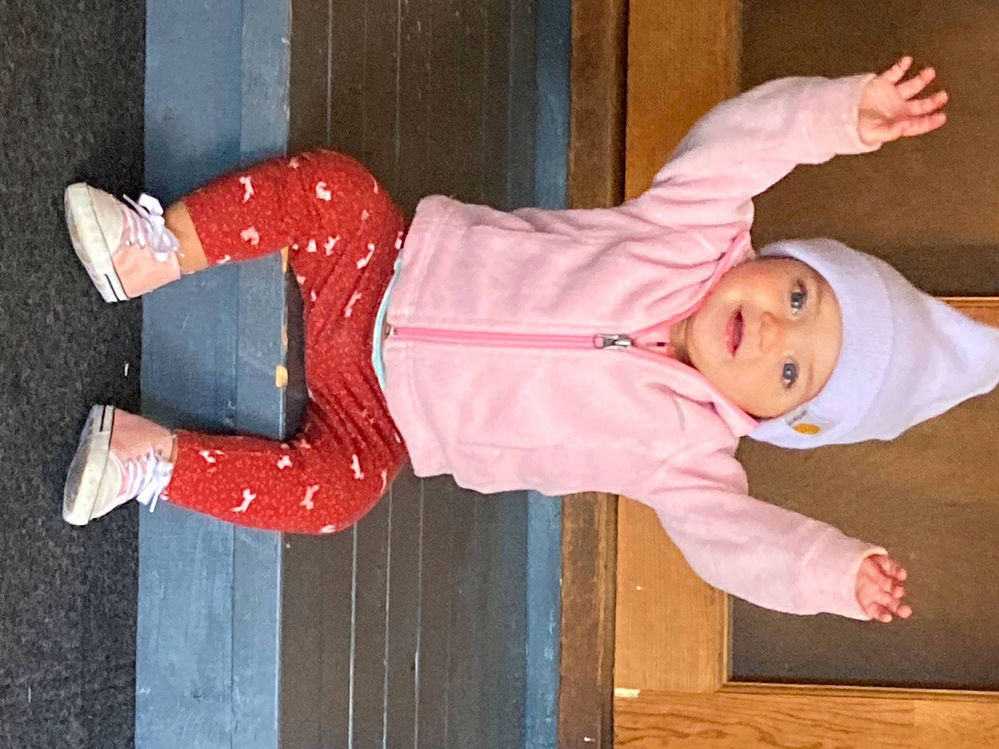 Aryah joined the competition — help win amazing prizes! baby, baby_products, baby_toddler_clothing, carmine, child, comfort, happy, headwear, human_leg, orange, person, sleeve, smile, textile, toddler, wood