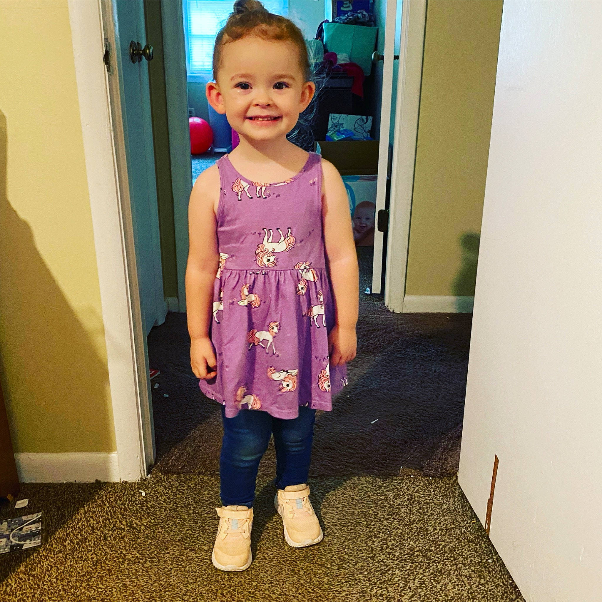Emma joined the competition — help win amazing prizes! baby_toddler_clothing, blue, child, door, electric_blue, eye, flooring, happy, joy, magenta, outerwear, pattern, person, pink, purple, sleeve, smile, standing, street_fashion, t_shirt