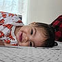 bed, blanket, child, cozy, curtain, cute, face, hair, happy, home, indoor, lobster_pattern, orange, person, playful, resting, shirt, smiling, toddler, young