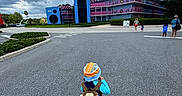 Zaylin joined the competition — help win amazing prizes! child, backpack, hat, road, building, cloudy_sky, asphalt, person, walking, tree, urban, colorful, music_notes, outdoor, daytime, nature, sky, people, adult, casual_clothing