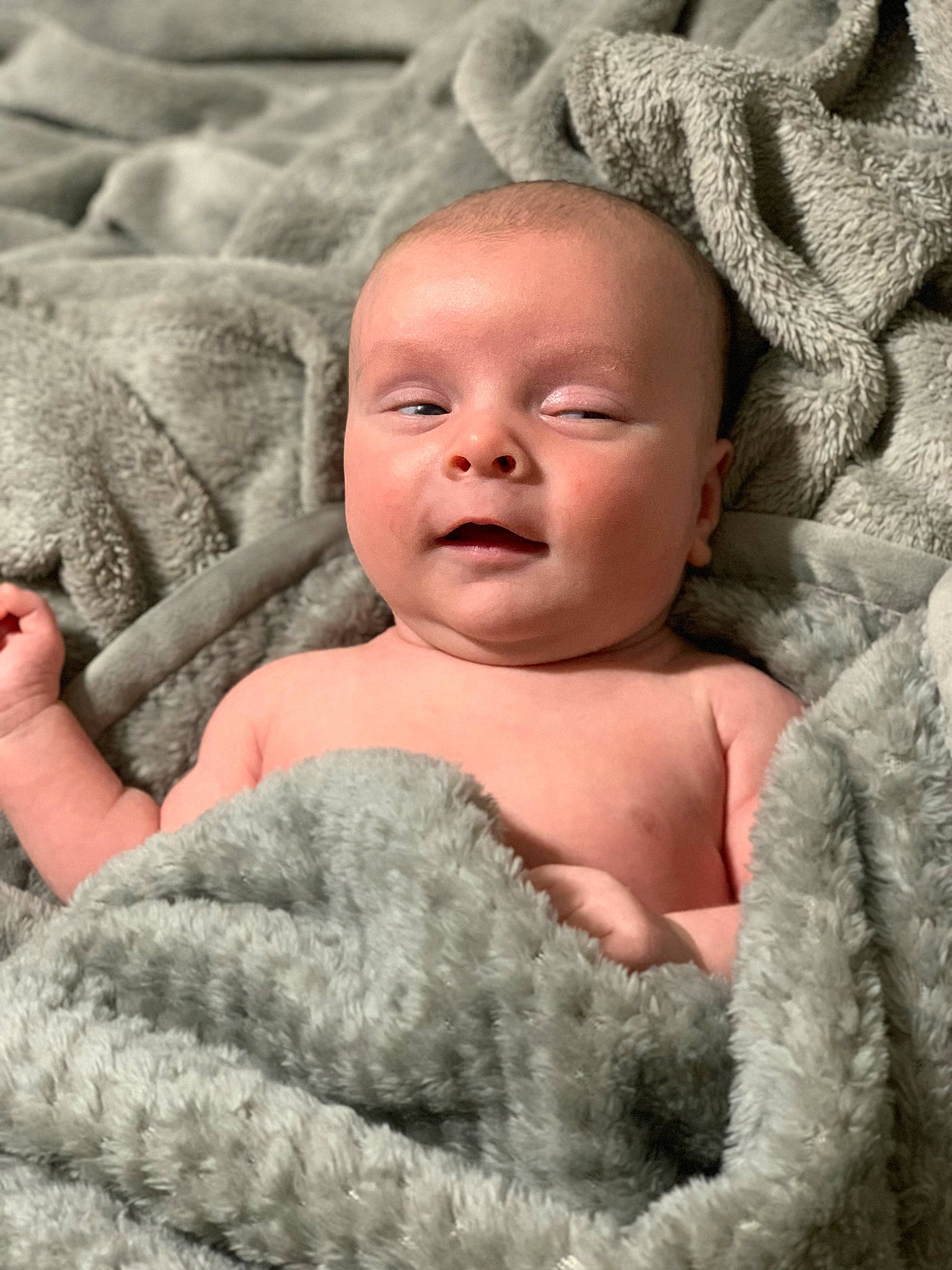 Winston is registered to the contest to win money with this photo: baby, beauty, cheek, chin, comfort, eyebrow, facial_expression, finger, gesture, happy, headgear, linens, lip, mammal, mouth, person, product, skin, smile, textile