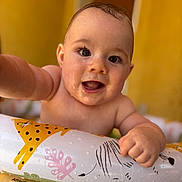 Malone participe au concours pour gagner de l'argent avec cette photo : baby, background, child, closeup, eyes, face, float, fun, hand, happy, inflatable, playful, pool, portrait, skin, smiling, summer, water, wet, yellow