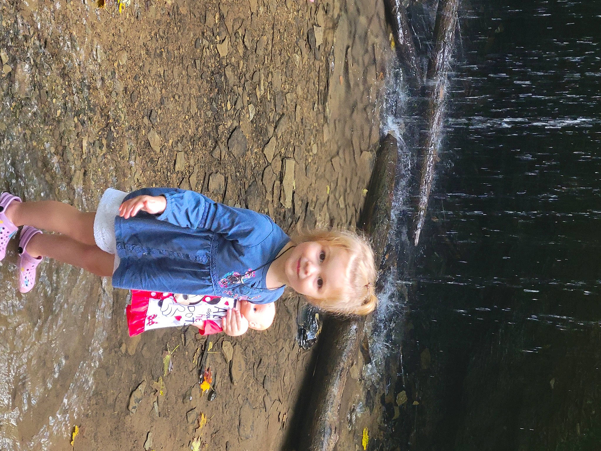 Charlee is registered to the contest to win money with this photo: adventure, child, electric_blue, fun, grass, happy, joy, landscape, leisure, people_in_nature, person, play, recreation, smile, soil, toddler, tree, vacation, wall, water