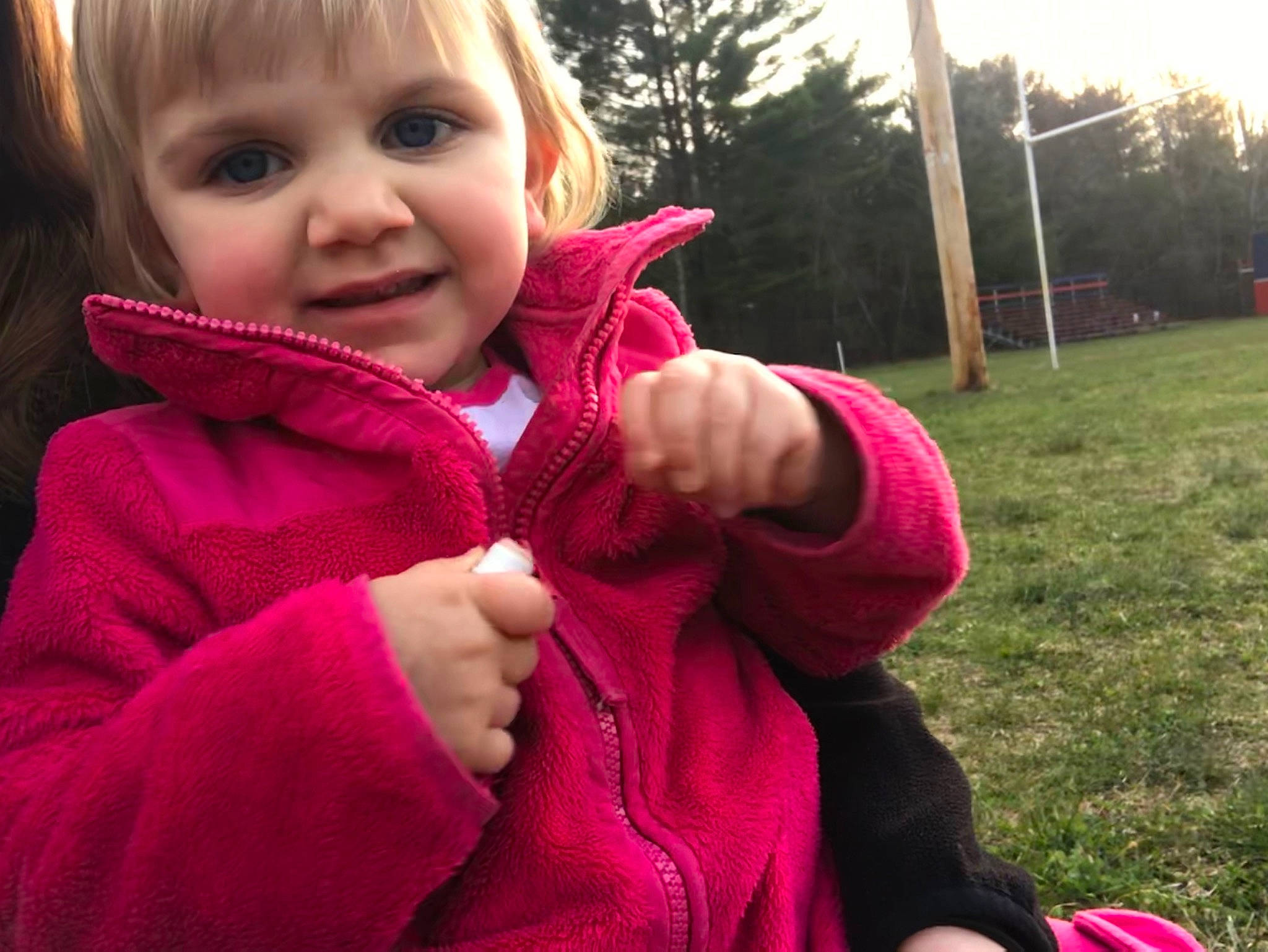 Acacia is registered to the contest to win money with this photo: cheek, child, cool, eye, face, finger, grass, hand, head, hoodie, jacket, joy, lip, nose, outerwear, people, person, pink, red, skin