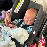 Dominic joined the competition — help win amazing prizes! baby, car_seat, blanket, infant, hand, car_interior, seatbelt, clothing, person, pink_nail_polish, child, striped_clothing, soft_texture, safety, cute, newborn, comfort, car, restraint, toddler