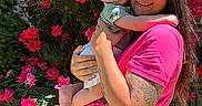 Jaxon joined the competition — help win amazing prizes! baby, brick_wall, bright_colors, child, flowers, garden, greenery, happy, holding, nature, outdoor, person, pink_shirt, portrait, roses, smile, sunlight, tattoo, tongue_out, woman