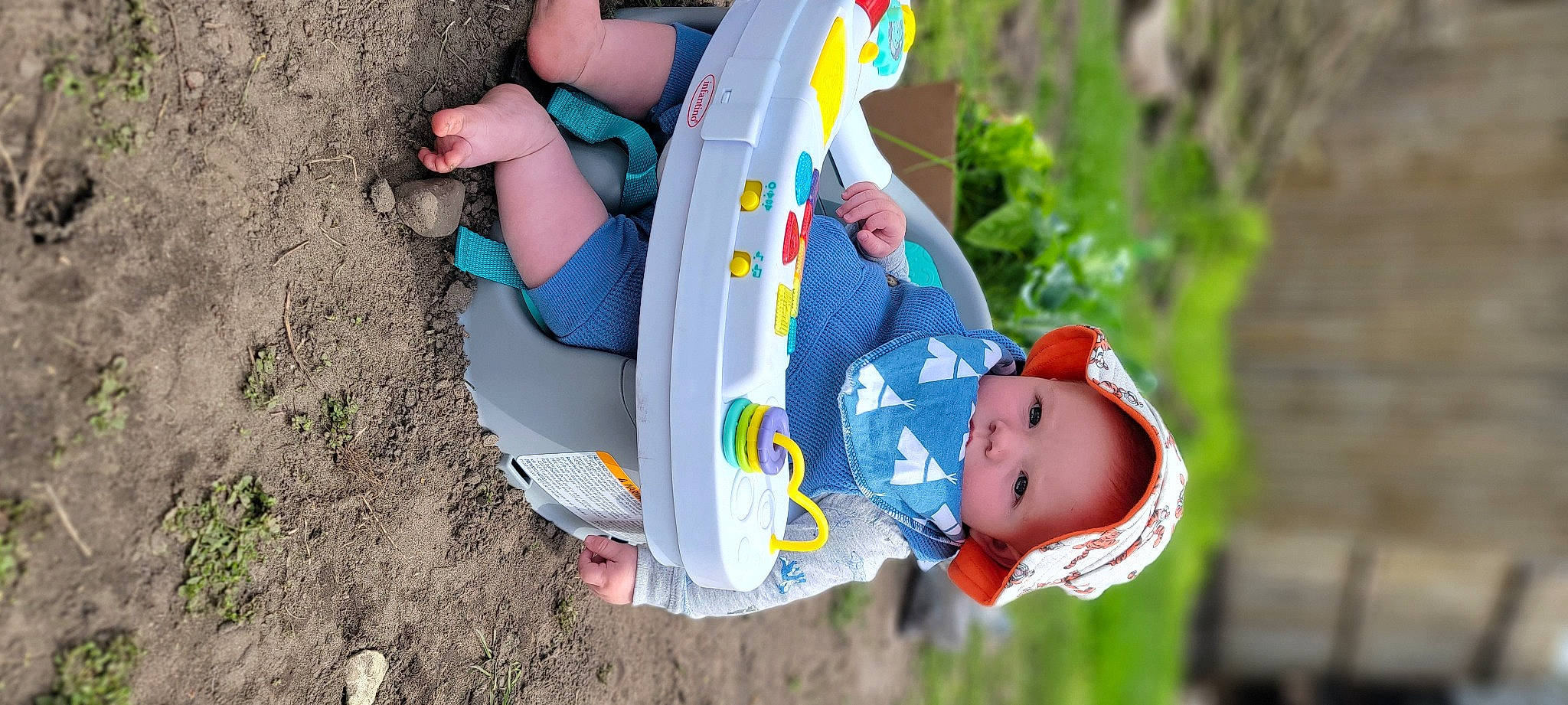 Beau is registered to the contest to win money with this photo: baby, baby_products, baby_toddler_clothing, blue, chair, child, fun, grass, hand, happy, headgear, leisure, people_in_nature, person, photograph, plant, play, recreation, sitting, toddler