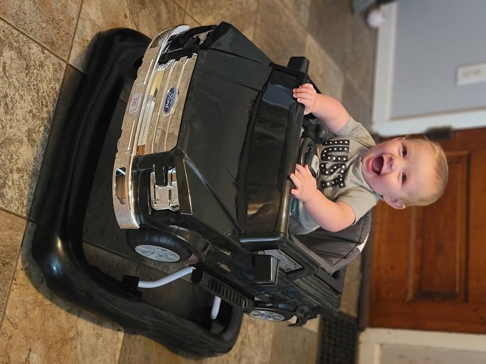 Beau is registered to the contest to win money with this photo: audio_equipment, auto_part, automotive_design, automotive_exterior, automotive_lighting, automotive_tire, automotive_wheel_system, backpack, bag, bumper, fender, flash_photography, headlamp, luggage_and_bags, motor_vehicle, person, personal_protective_equipment, tire, toddler, vehicle