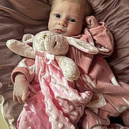 Hazel joined the competition — help win amazing prizes! baby, infant, plush_toy, pink_blanket, pink_clothing, soft_texture, cute, child, cozy, indoors, sleepwear, newborn, lying_down, stuffed_animal, comfort, portrait, adorable, snuggle, warm, resting