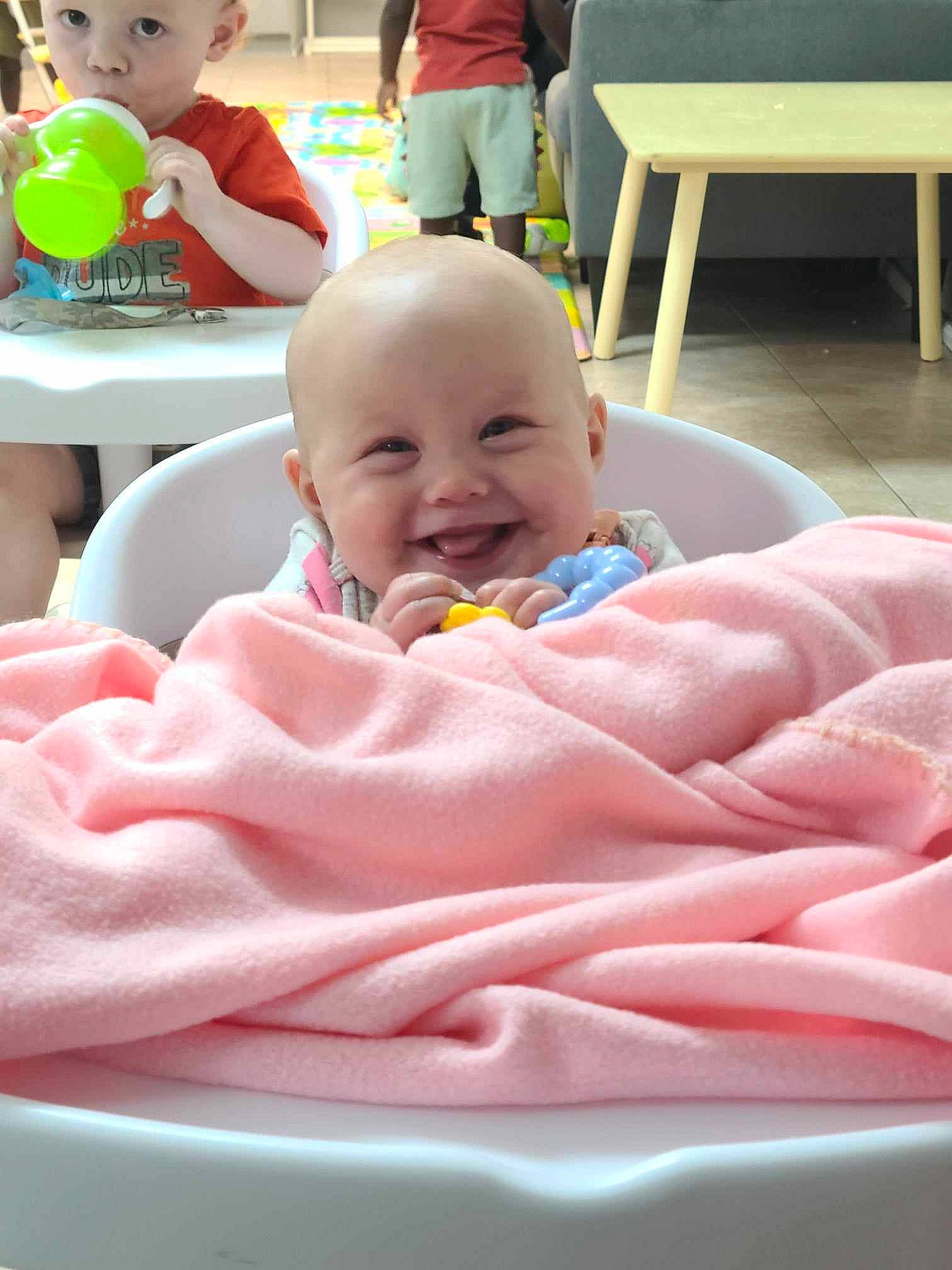 Emery joined the competition — help win amazing prizes! baby, baby_laughing, baby_products, baby_toddler_clothing, chair, cheek, child, comfort, event, fun, green, happy, headwear, joy, leisure, person, pink, play, sitting, skin