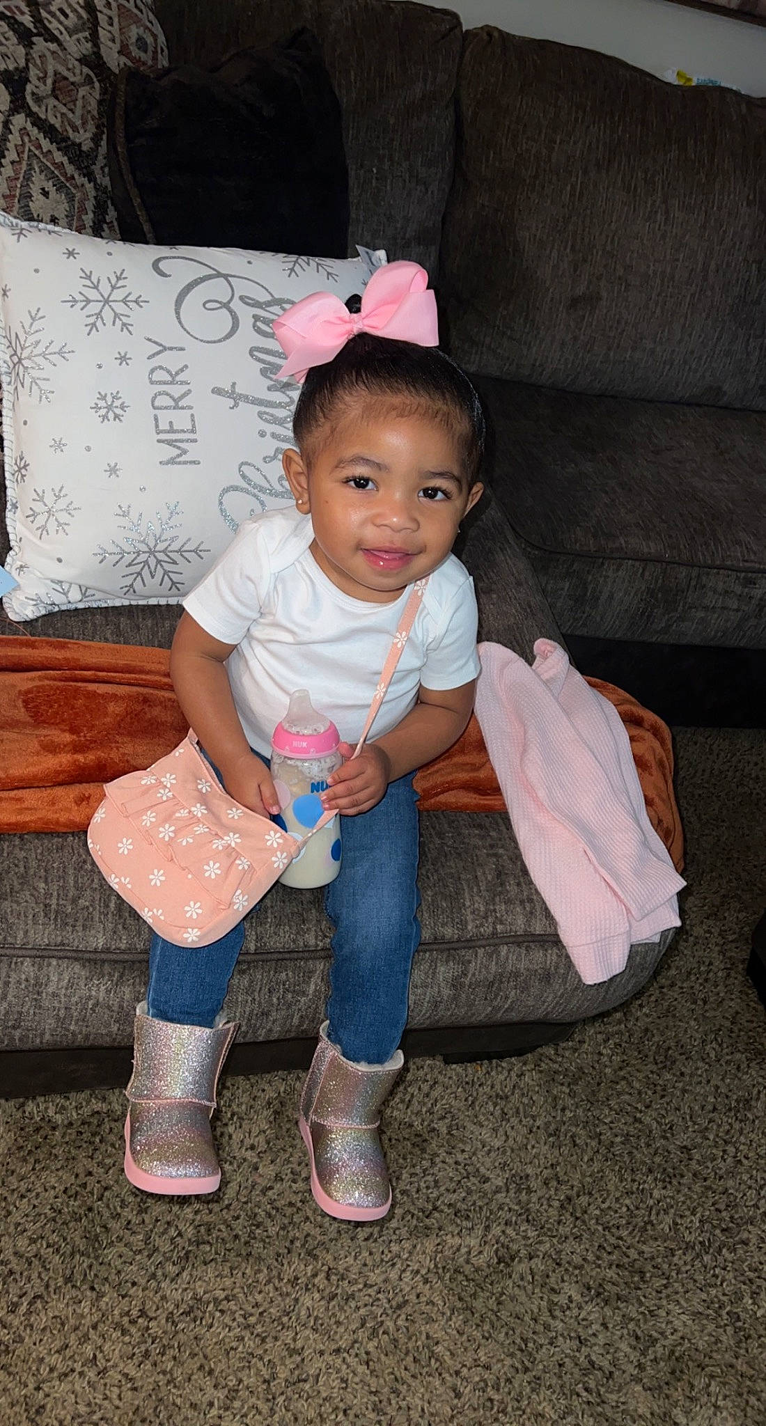 Miah joined the competition — help win amazing prizes! baby_toddler_clothing, boot, cheek, child, eye, flash_photography, foot, fun, happy, head, human_body, human_leg, joy, magenta, person, sandal, sitting, skin, sleeve, sneakers