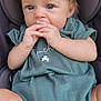 baby, child, infant, blue_eyes, blonde_hair, car_seat, green_clothing, onesie, hands, fingers, sitting, cute, portrait, young_child, indoor, expression, closeup, face, person, skin